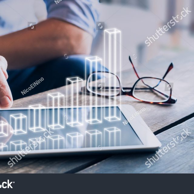 stock-photo-businessman-analyzing-growing-d-ar-chart-floating-above-digital-tablet-computer-screen-showing-734391004
