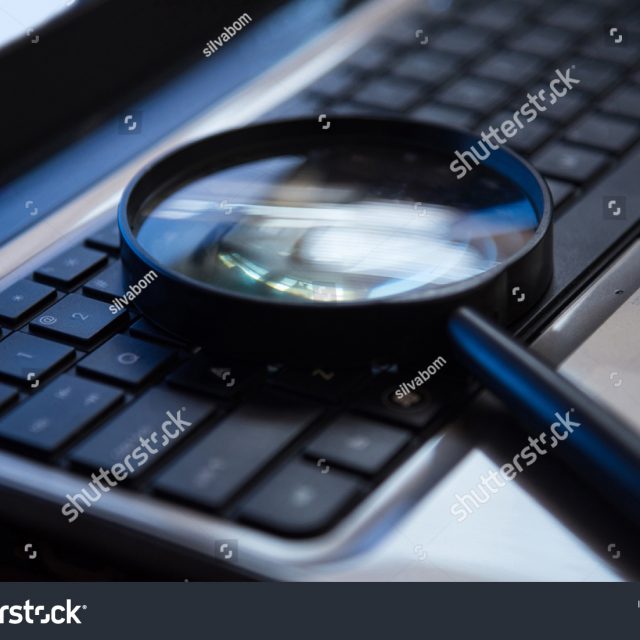 stock-photo-selective-focus-on-keyboard-with-magnifier-searching-concept-in-dark-low-key-night-tone-494287042